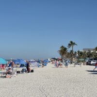 CREW SWFL Beach Cleanup Day - CREW members on the beach cleaning up